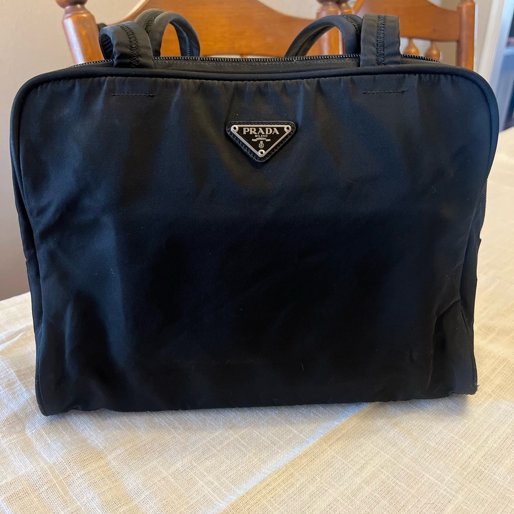 Prada Black Bag with Nylon Fabric and Zipper Closure has a Key & Lock